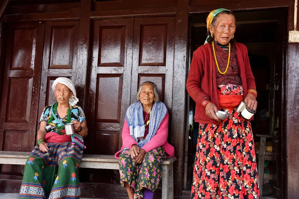 Three Nepali Sisters were taking tea and gossiping when the photo was taken. it was also in Num village in east nepal during my trek around Makalu base camp on 2023.