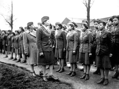 The 6888th Central Postal Directory Battalion stands at attention during an inspection in England in 1945.