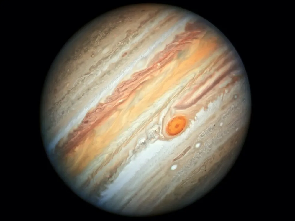 Jupiter, tilted, with its bands and Great Red Spot clearly visible